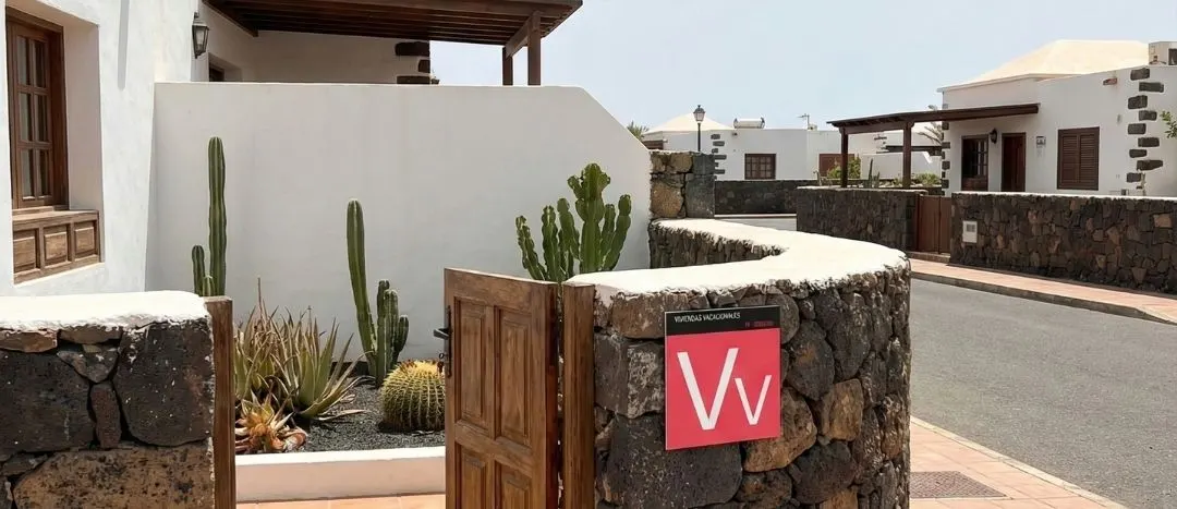 White Canary Islands homes with cacti and stone walls